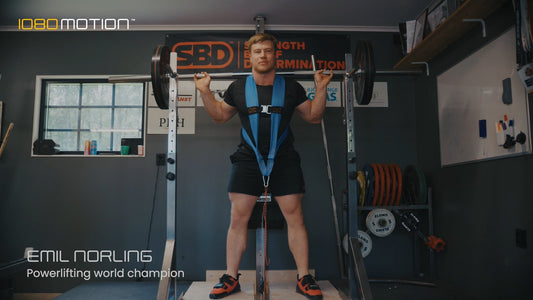 World Champion Emil Norling performing barbell squat with 1080 Cable for isokinetic and eccentric overload training
